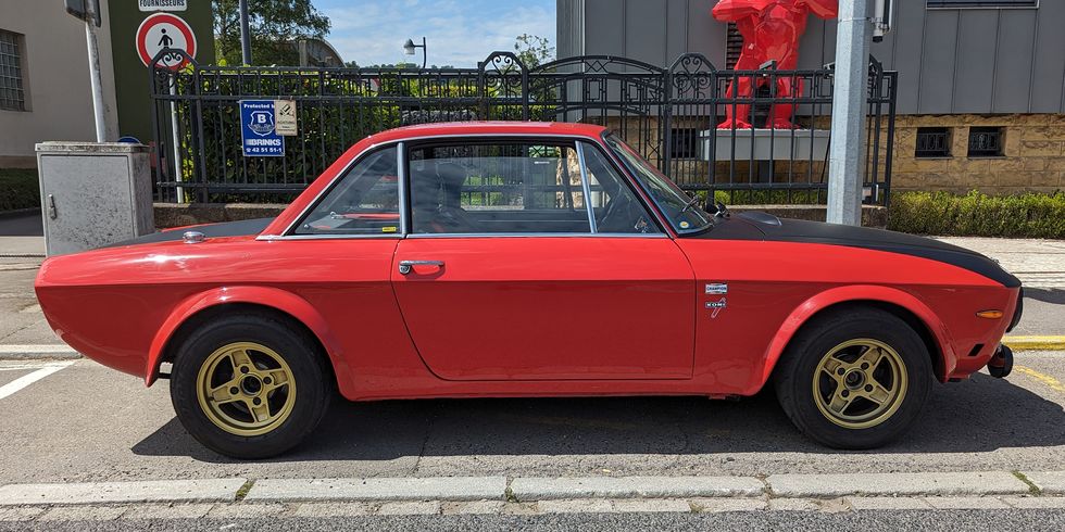 lancia fulvia 13s coupe parked on street in luxembourg