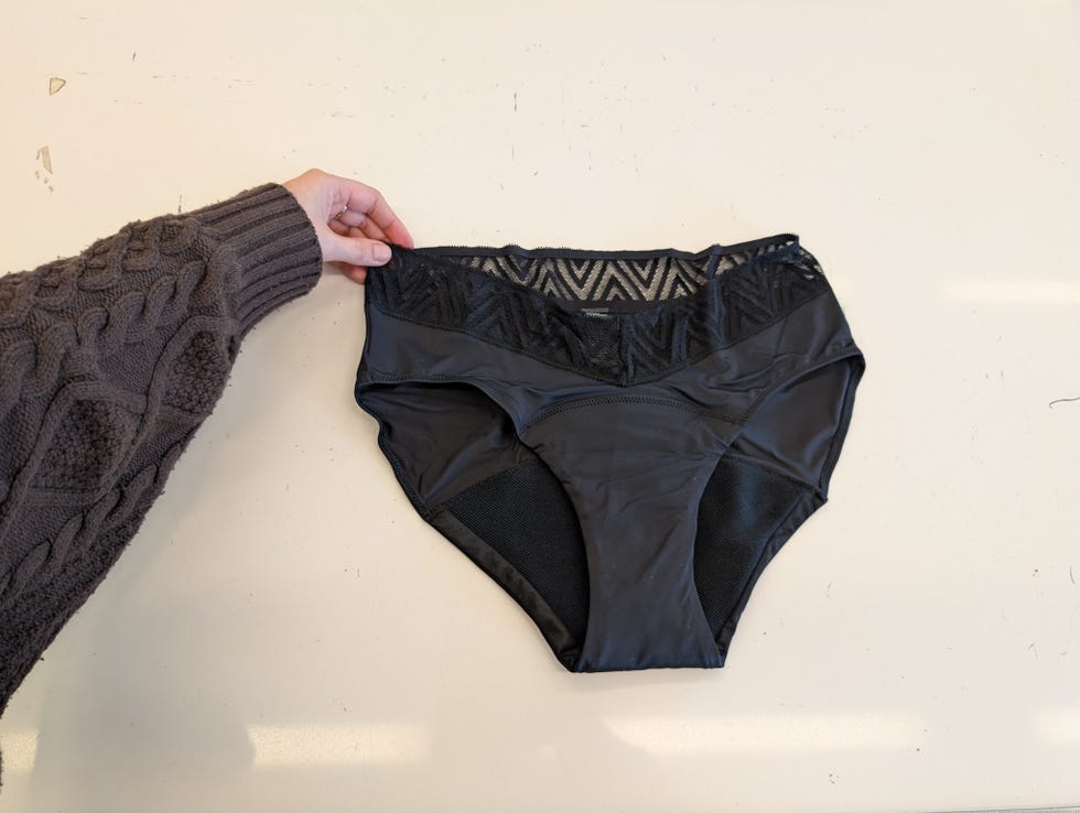 a gh analyst evaluating a pair of black thinx hiphugger period underwear, good housekeeping's testing for the best period underwear
