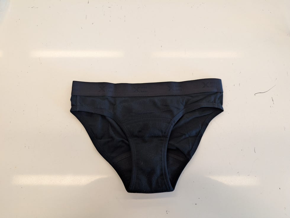 a black pair of tomboyx period underwear on a white table, good housekeeping's best period underwear testing