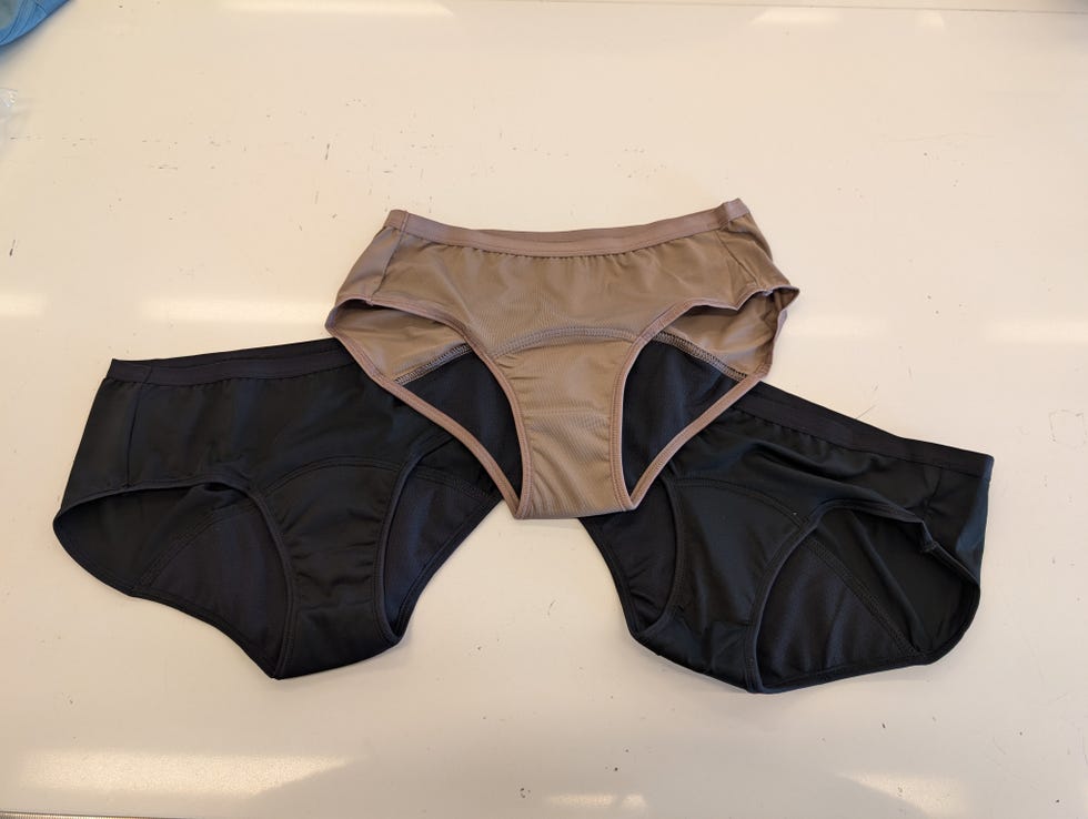 three pairs of hanes period underwear on a white table, good housekeeping's testing for the best period underwear