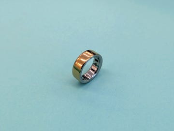 metallic ring placed on a light blue background