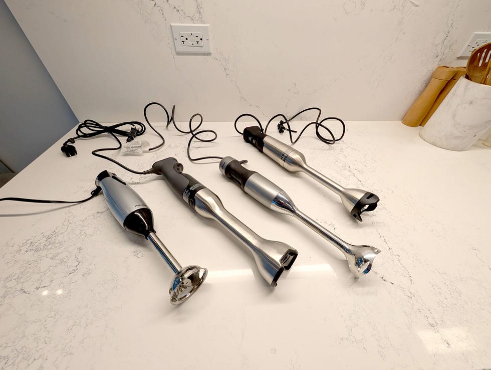 four immersion blenders side by side on countertop