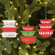 christmas ornaments in shape of pyrex bowl and casserole dish stack in holiday patterns