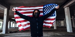 afroamerican man wearing hoodie and black facial mask anti racism concept