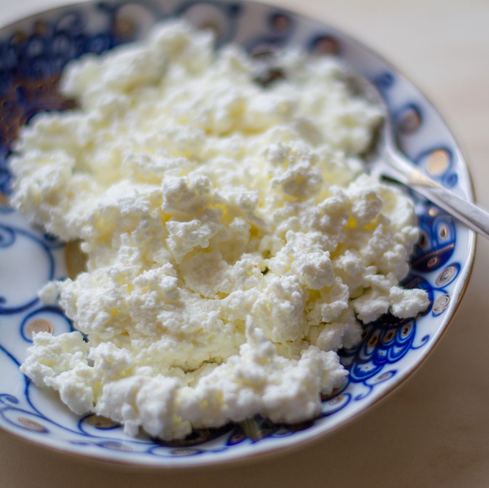 fresh cottage cheese on old wooden table