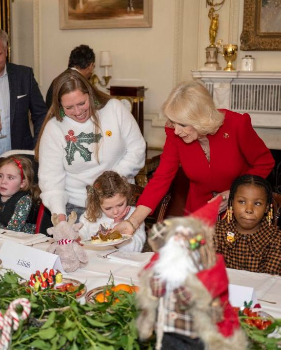 london, england december 7 her majesty, camilla, the queen consort helps to serve lunch for children at clarence house on december 7, 2022 in london, england the queen consort supported by helen douglas house and roald dahls marvellous childrens charity to decorate the christmas tree and receive a few festive surprises photo by paul grover wpa poolgetty images