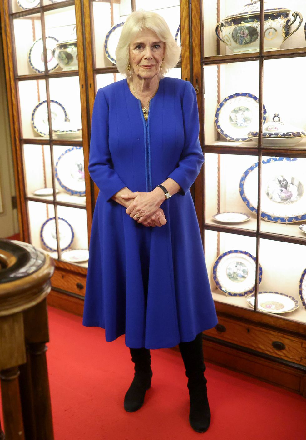 Queen Camilla dresses in royal blue for charity reception