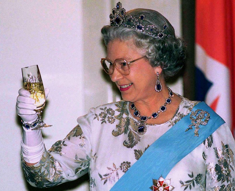 warsaw, poland   march 25  queen at banquet at presidential palace toasting her host with a glass of champagne in warsaw during her visit to poland  photo by tim graham photo library via getty images