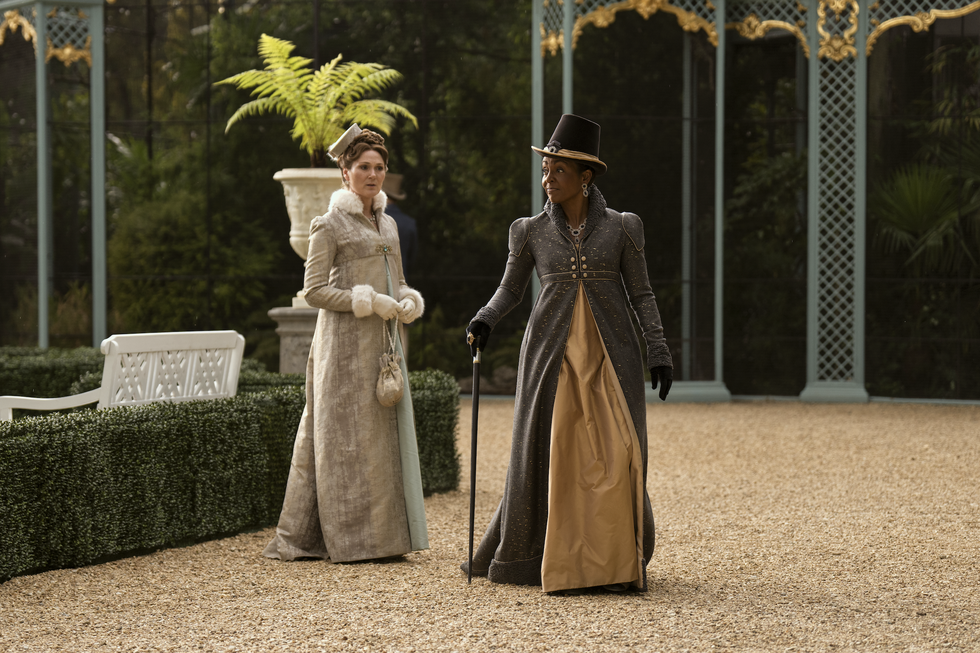 ruth gemmell as violet bridgerton and adjoa andoh as lady agatha danbury walking in episode 106 of queen charlotte