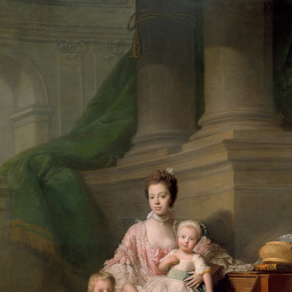 queen charlotte posing for a portrait with two of her children