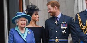 The Queen on the Buckingham Palace balcony with the Duke and Duchess of Sussex