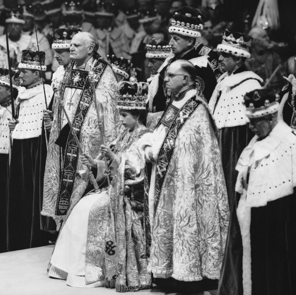 2nd june 1953 queen elizabeth ii seated upon the throne at her coronation in westminster abbey, london she is holding the royal sceptre ensign of kingly power and justice and the rod with the dove symbolising equity and mercy photo by topical press agencygetty images