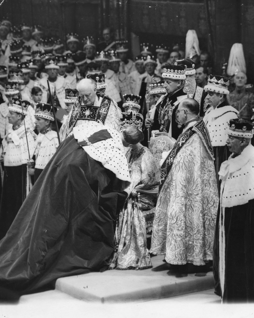 prince philip, the duke of edinburgh giving a kiss of homage to the queen during her coronation ceremony