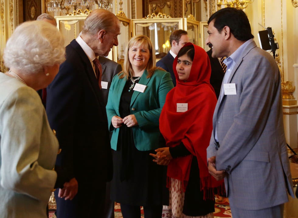 queen elizabeth ii receives malala at buckingham palace