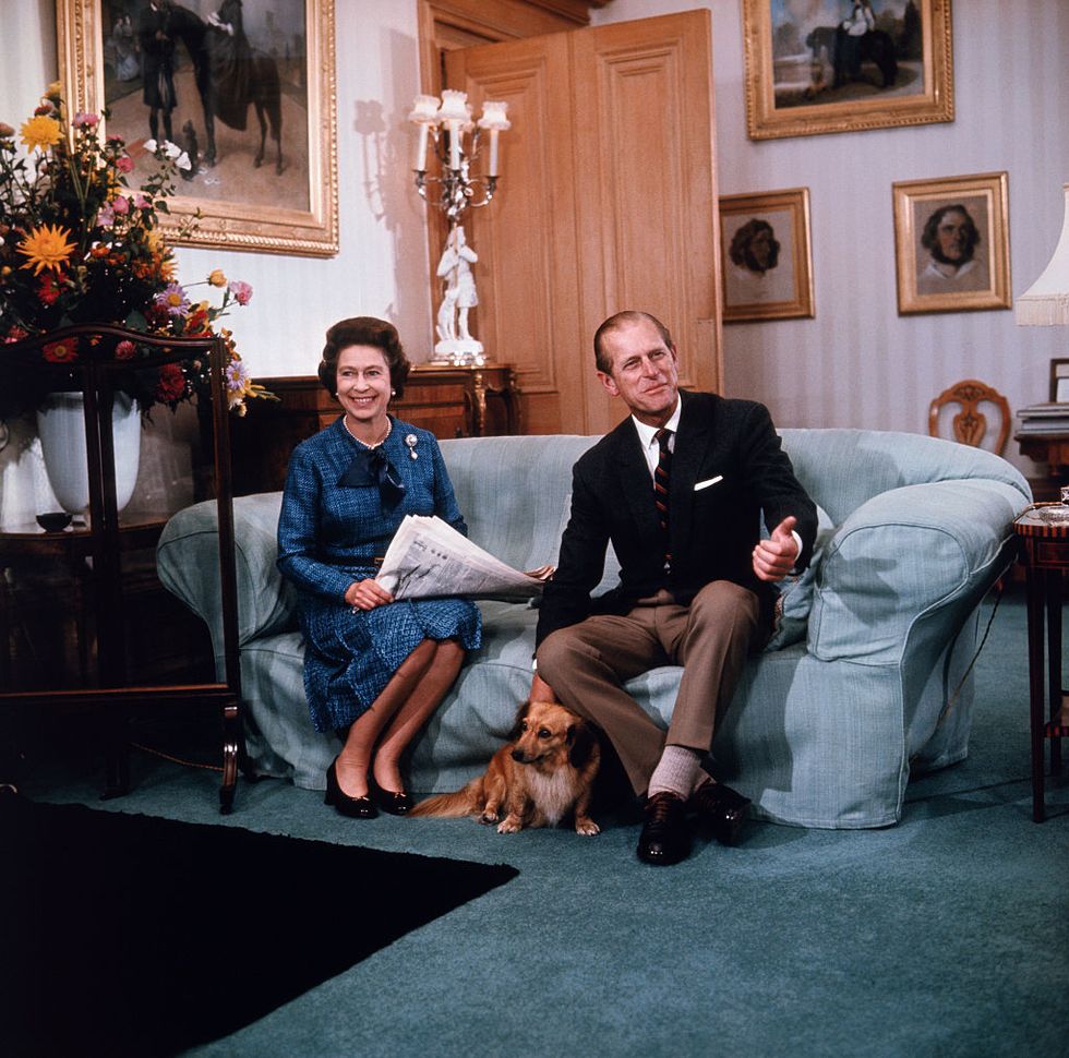 queen elizabeth and prince philip relaxing on couch