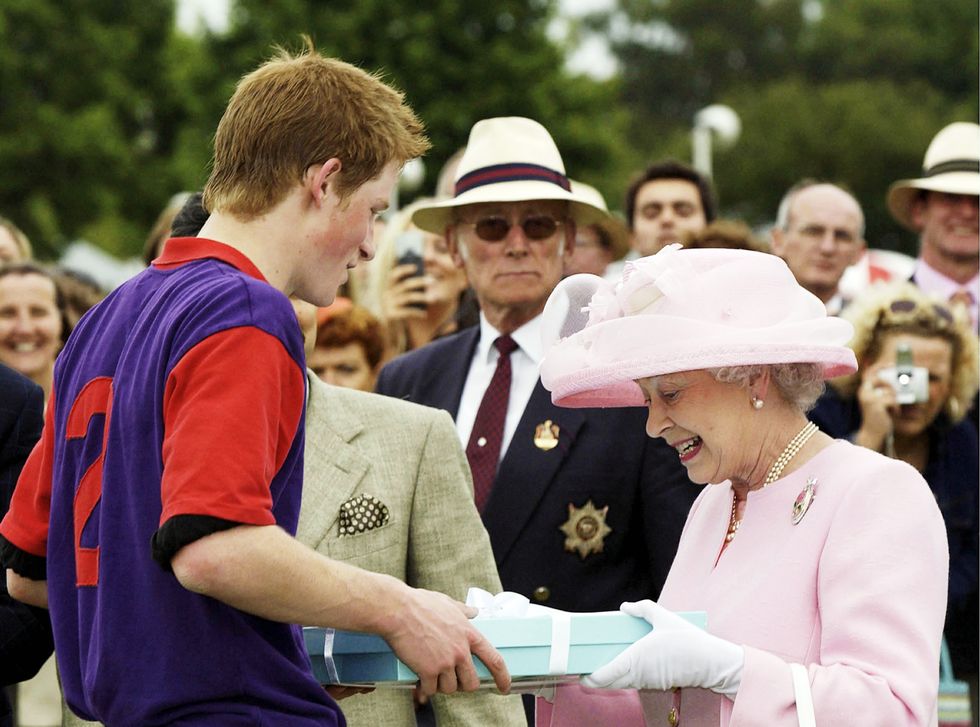 queen elizabeth ii makes a presentation to prince harry at royal ascot