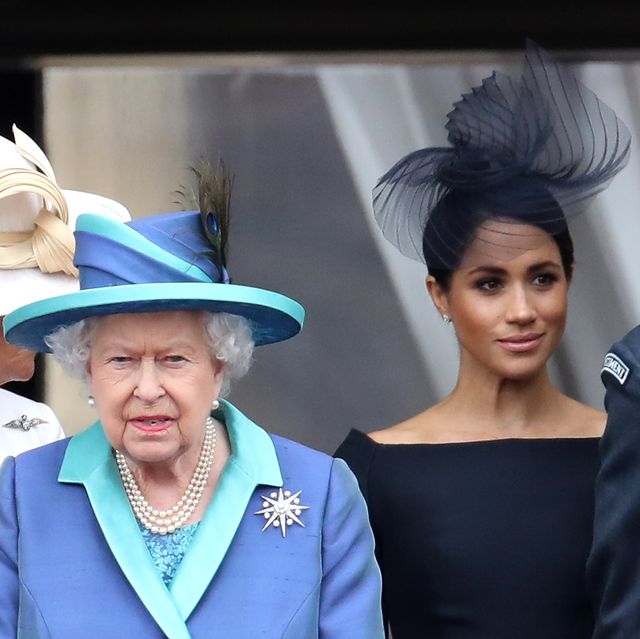the queen, meghan markle, and prince harry during the centenary of the raf