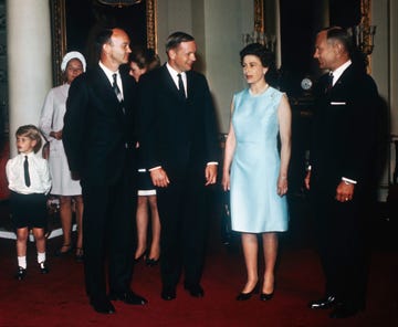 Queen Elizabeth II, Michael Collins, Neil Armstrong and Buzz Aldrin at Buckingham Palace as part of their world tour