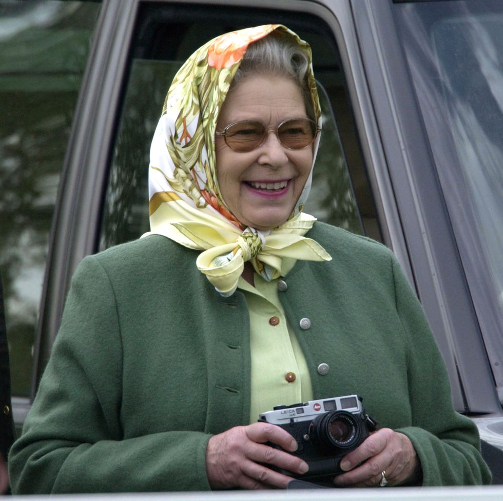 queen smiling camera