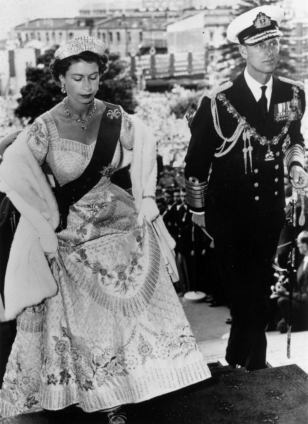 a woman in a dress and a man in a military uniform