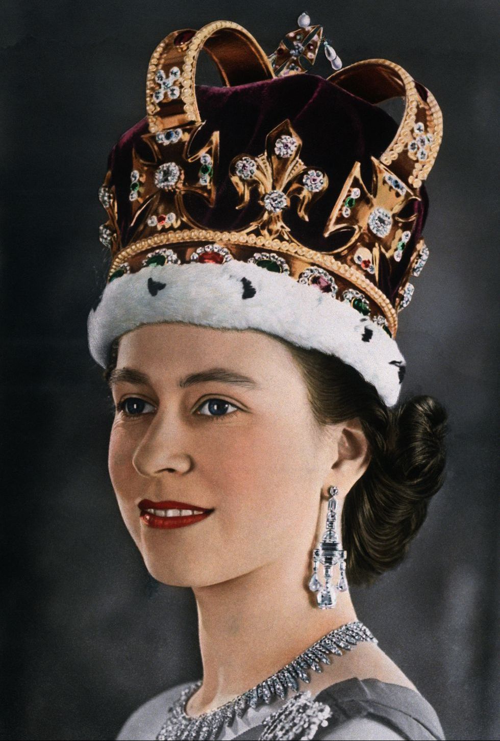 a photo of queen elizabeth wearing red lipstick at her coronation,  one of good housekeeping's royal beauty hacks