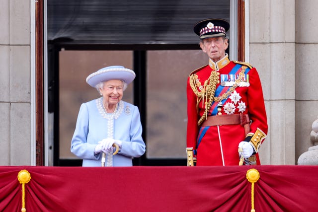 The Queen takes the royal salute on Buckingham Palace's balcony