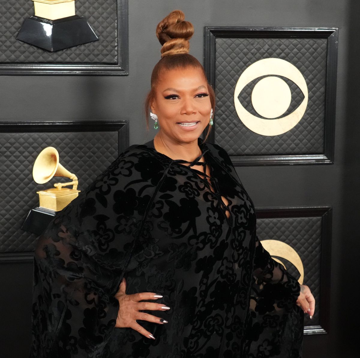 Queen Latifah floats in floor length gown at the Grammy Awards