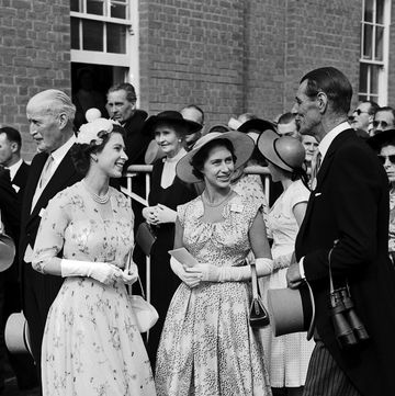 Queen Elizabeth II and Princess Margaret greet trainer Noel Murless