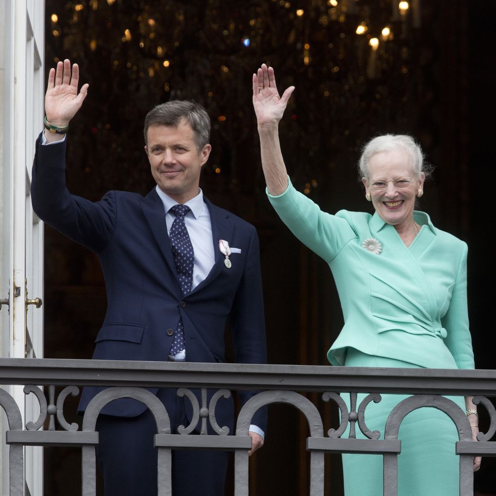 a man and woman waving