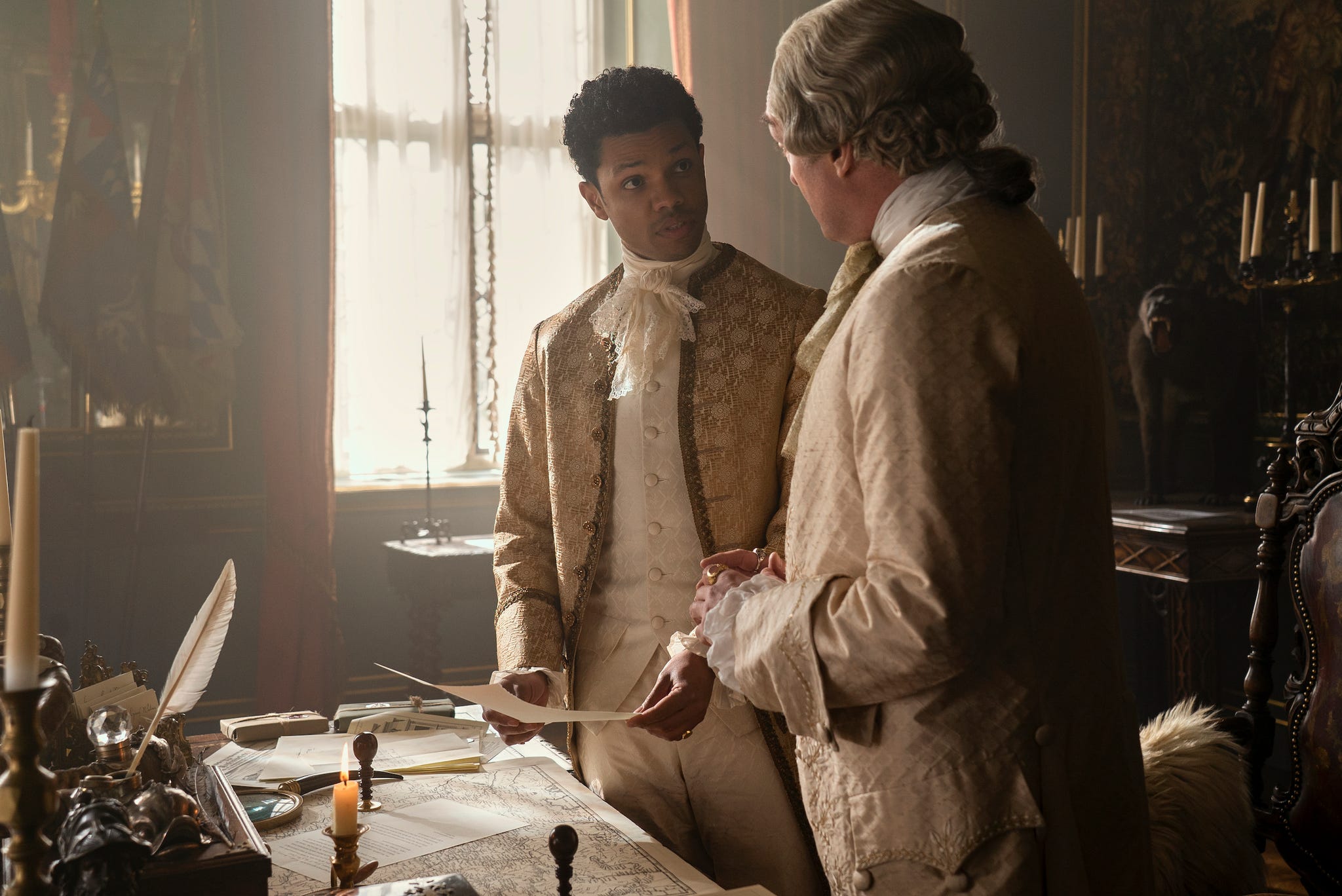 queen charlotte a bridgerton story l to r tunji kasim as adolphus, neil edmond as earl harcourt in episode 101 of queen charlotte a bridgerton story cr liam danielnetflix © 2023