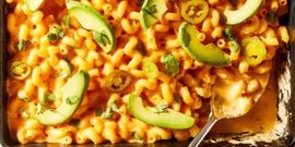 mac and cheese topped with sliced avocado and jalapenos