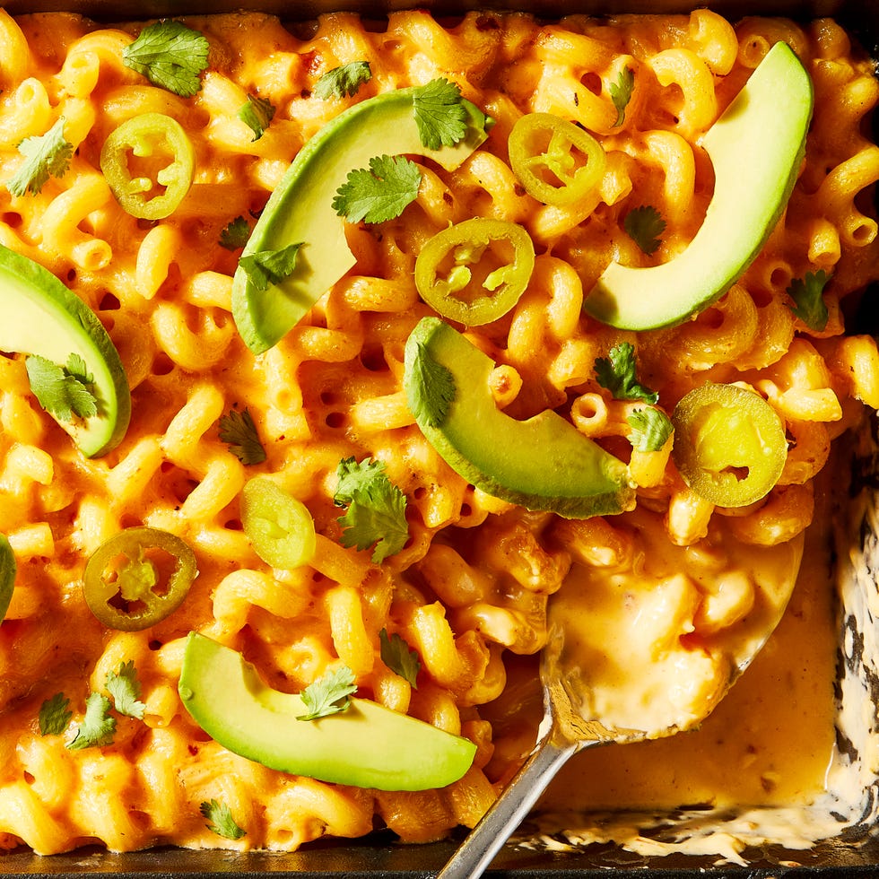 mac and cheese topped with sliced avocado and jalapenos