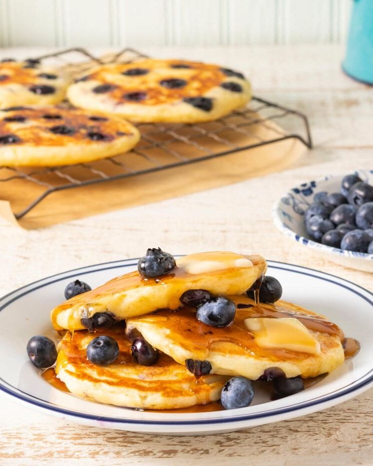 blueberry pancakes with fresh berries and butter