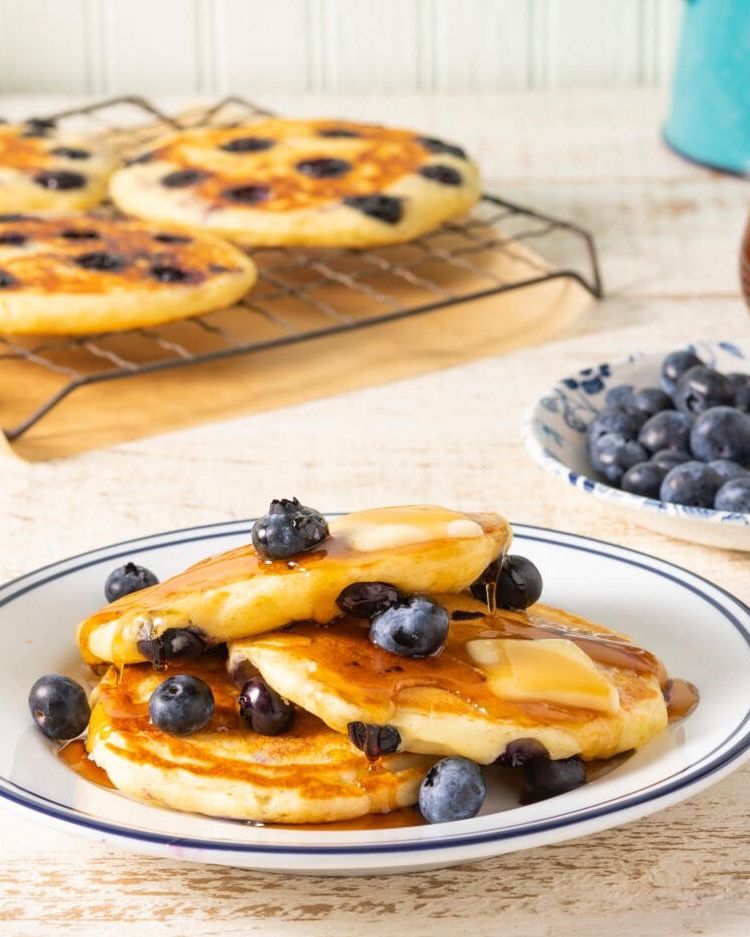 blueberry pancakes with fresh berries and butter