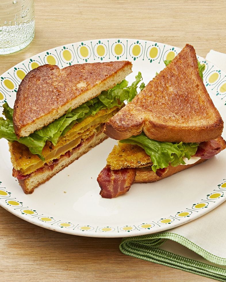 fried green tomato blt on white plate with yellow dots