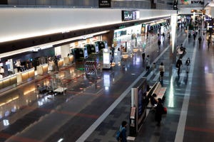 quiet lobby with a few travellers at tokyo haneda