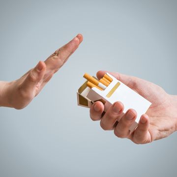 quitting smoking concept hand is refusing cigarette offer