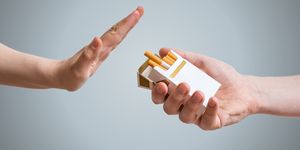 quitting smoking concept hand is refusing cigarette offer