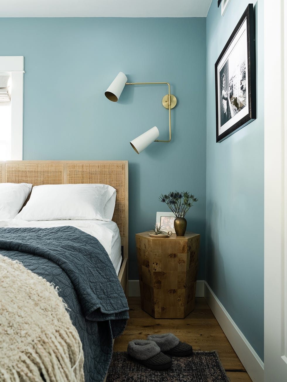 a bedroom with a bed and a table