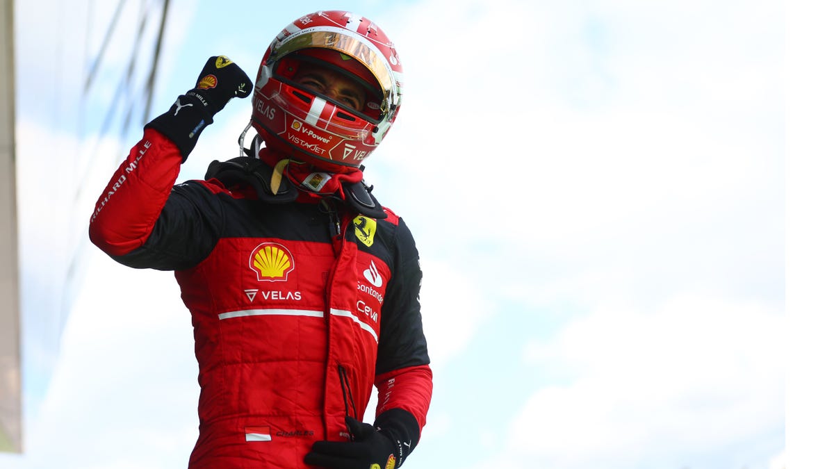 Race winner Charles Leclerc celebrate on the podium with the