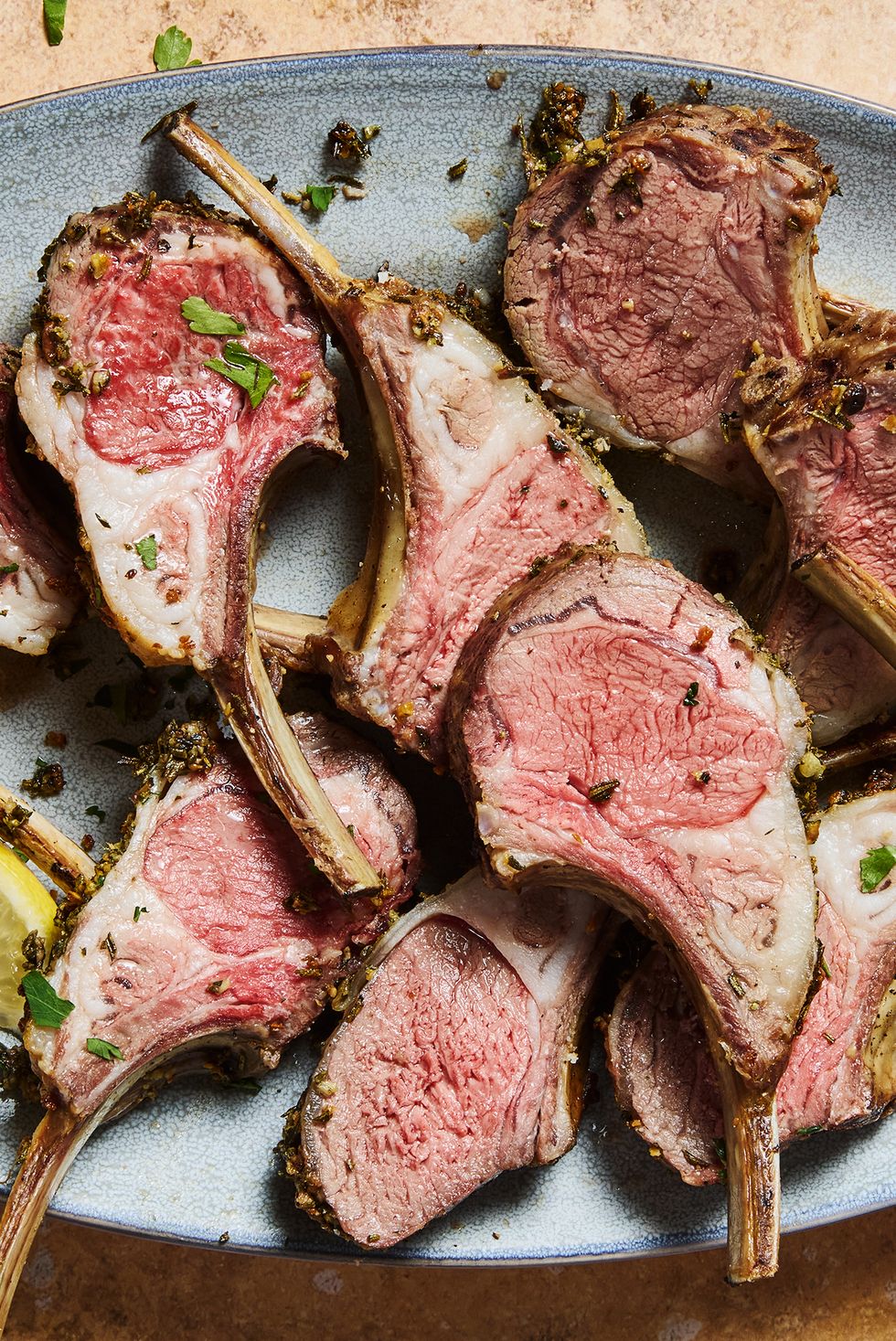 roasted rack of lamb served with lemon wedges