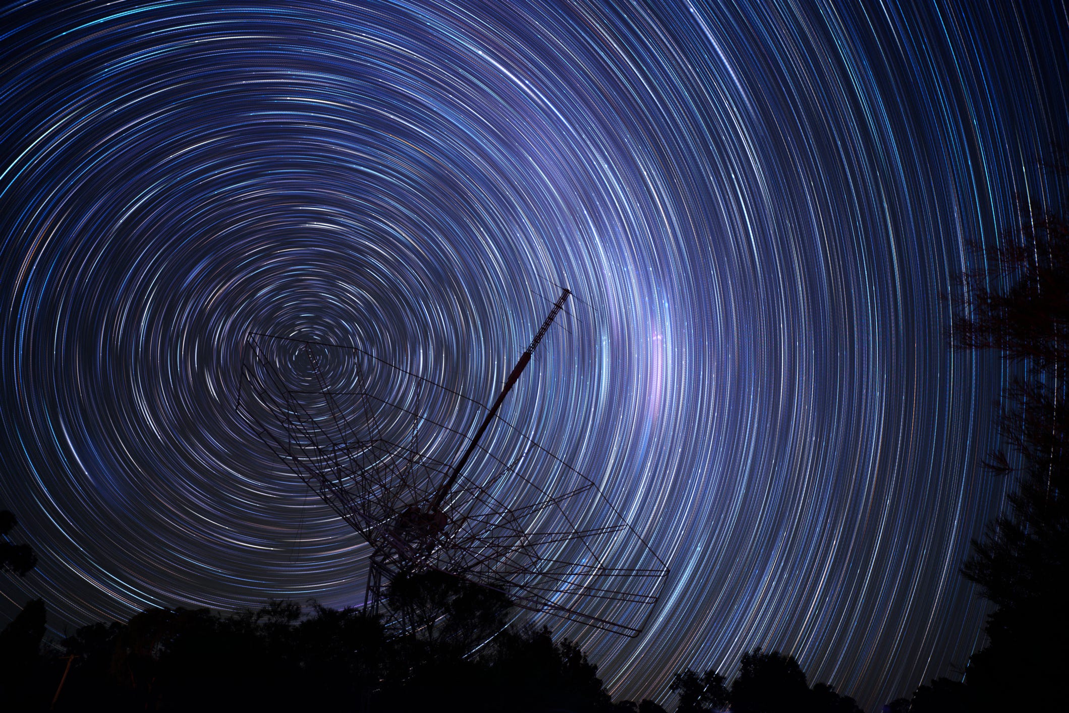 radio-antenna-against-star-trails-royalty-free-image-1730494359.jpg