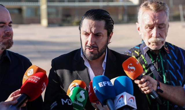 a group of men holding microphones