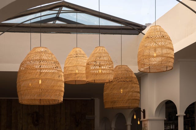 raffia natural lamps hanging in the ceiling in javea, alicante, spain