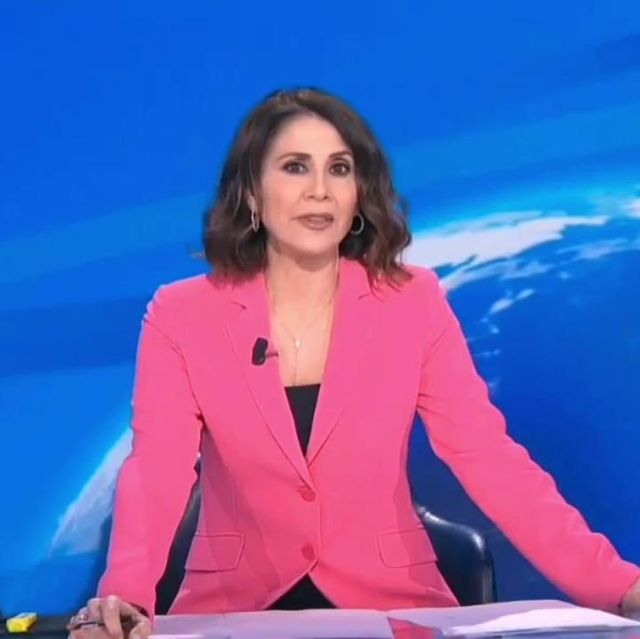 a woman in a pink suit