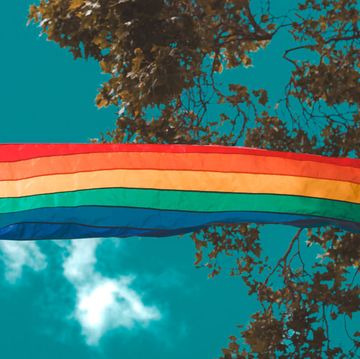 rainbow flag flying in the californian blue sky during san