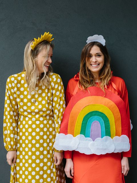 two women dressed as sunshine and rainbow costume