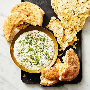 flatbread served with a side of raita to dip