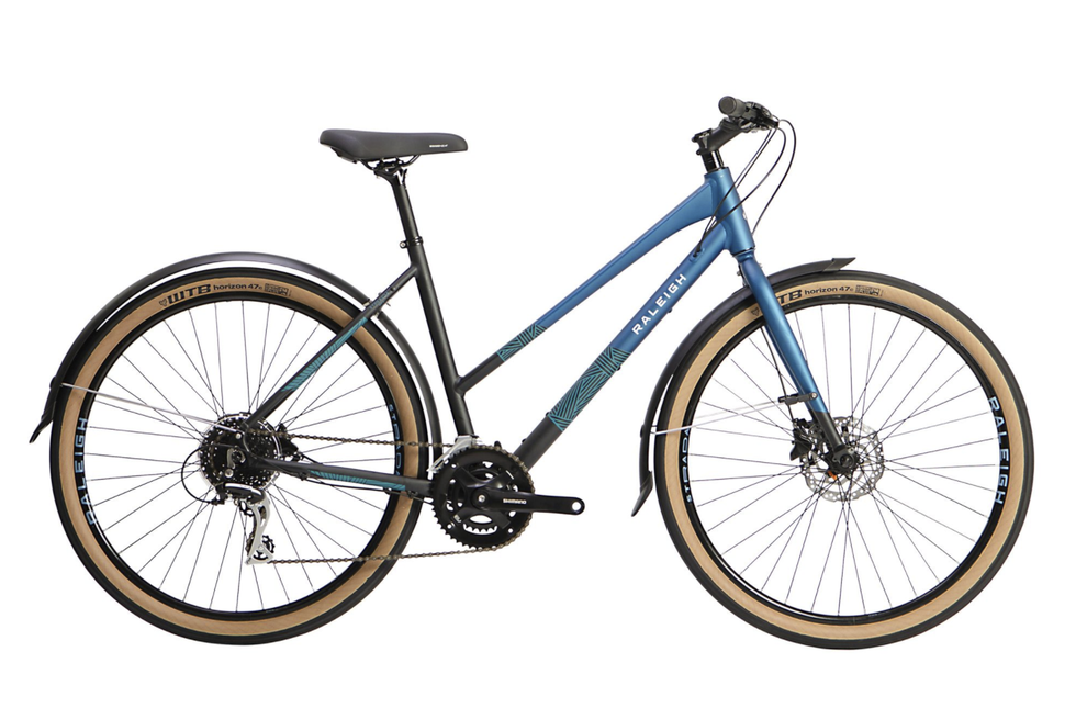 step through bike with blue and green patterned frame and beige and black wheels, black handle bars and seat