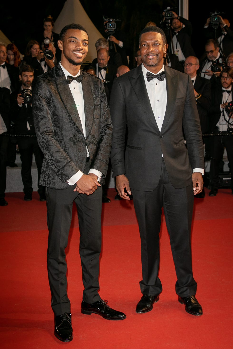 Suit, Red carpet, Carpet, Formal wear, Event, Tuxedo, Premiere, Flooring, Fashion, Facial hair, 